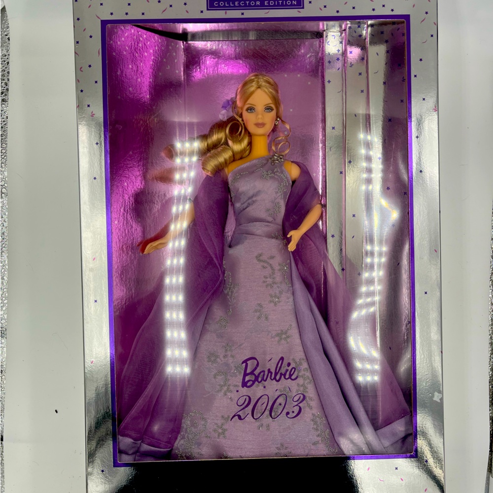 Collectors edition Barbie 2003 in purple dress by Mattel. NIB.